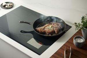 Searing steak on 30-inch Induction Cooktop in cast iron skillet