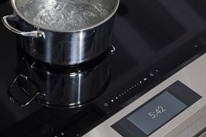 Wolf 36&quot; Induction Range (IR36550/S/T) shown with Boost Mode in action offering quick boil heat zone. 