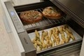 Wolf Appliance's WWD3050 open with different breads inside.