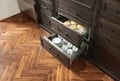 Sub-Zero, Wolf, and Cove's 30" Warming Drawer with cups on the bottom section and bread on the top.