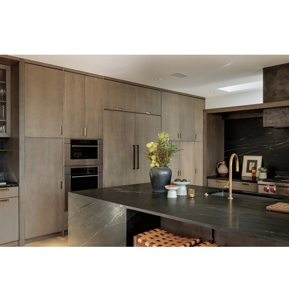 Wolf 24 Inch E Series Transitional Coffee System featured in a luxury coffee bar area with leather swing back chairs