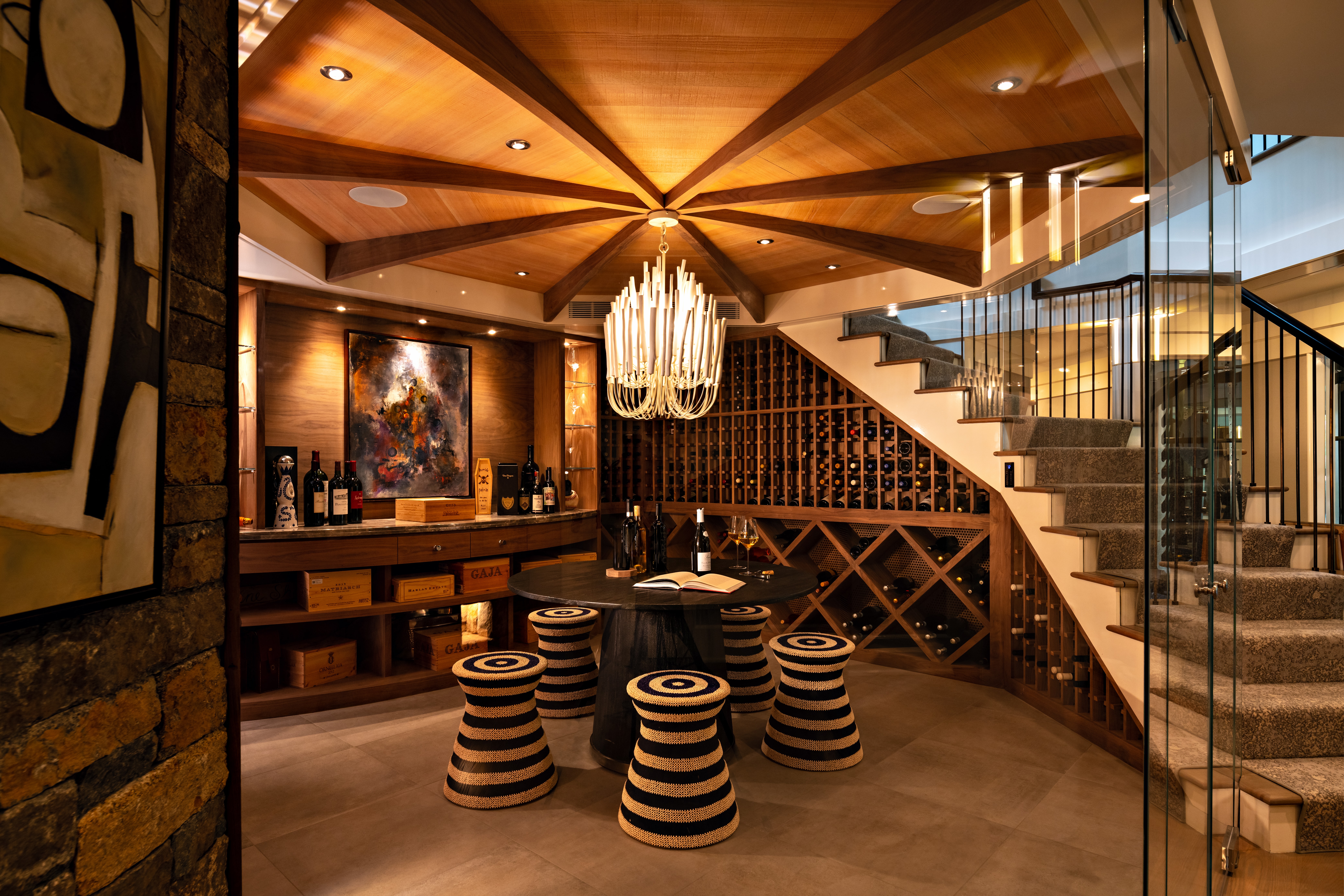 A cavern-like wine cellar for storage and celebration is the centerpiece of a New England home.