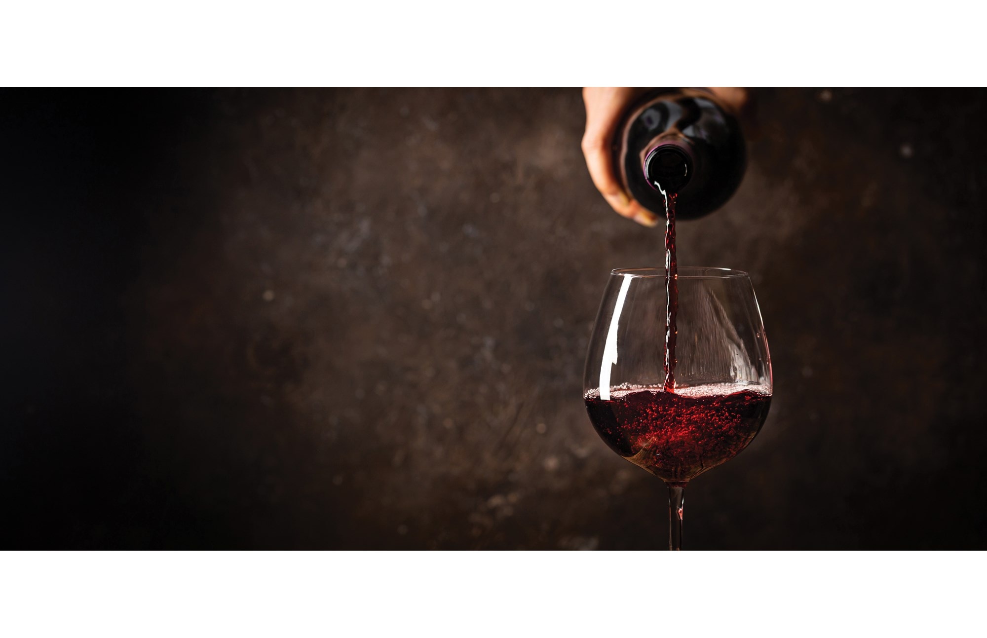 A cavern-like wine cellar for storage and celebration is the centerpiece of a New England home.