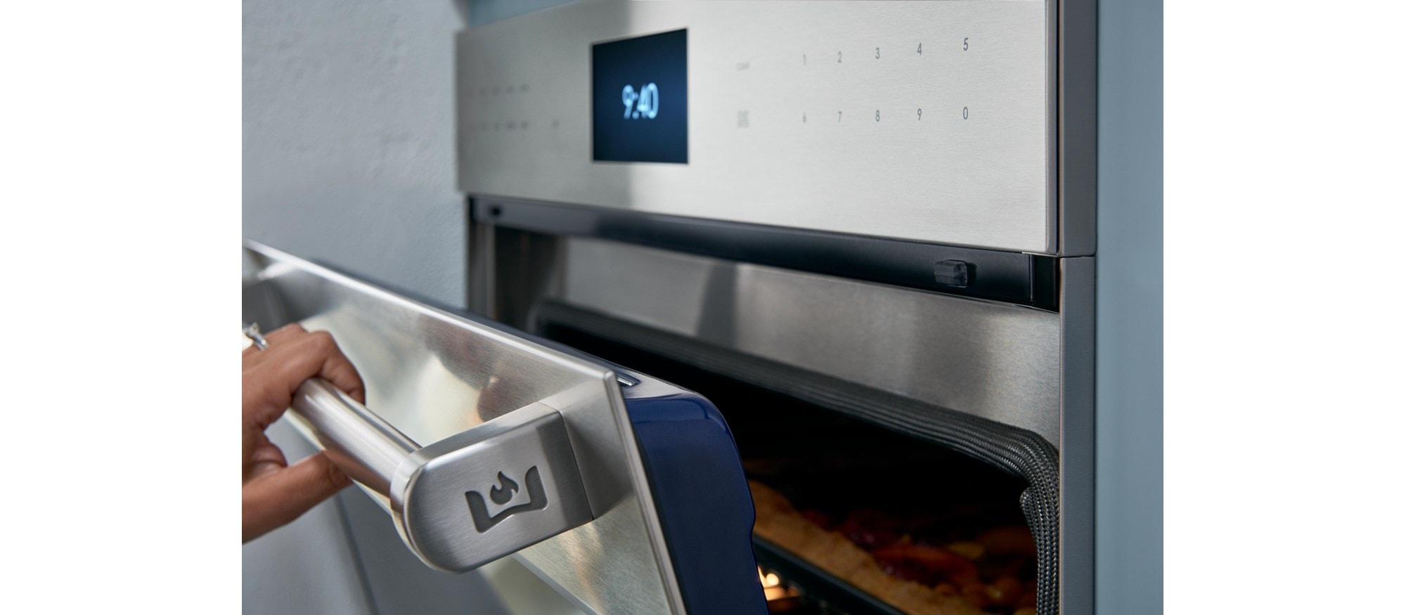 Chef product demonstration with Wolf Dual Stacked Burners at Sub-Zero, Wolf and Cove Showroom in Parma, Ohio