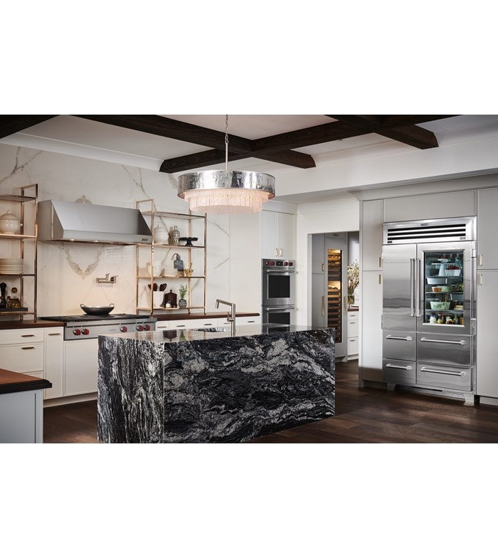 Sub-Zero 48 inch Pro Refrigerator and Freezer with Glass Door displayed in a custom kitchen design featuring large marble kitchen island
