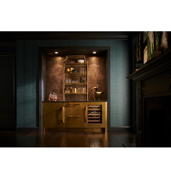 Sub-Zero Designer Series Undercounter Wine Storage Refrigerator featured in a beautiful, bronze colored space.