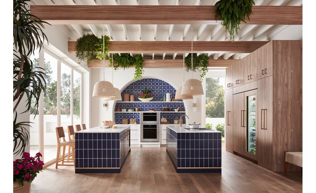 Wolf 30 Inch M Series Transitional Convection Steam Oven displayed in a Mediterranean kitchen design featuring double island, custom blue tile backsplash and exposed wood beam ceiling
