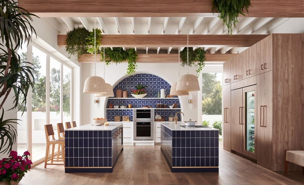 Wolf 30 Inch M Series Transitional Convection Steam Oven displayed in a Mediterranean kitchen design featuring double island, custom blue tile backsplash and exposed wood beam ceiling