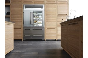 Sub-Zero Pro Series Stainless Steel Refrigerator displayed in kitchen with light wood cabinetry