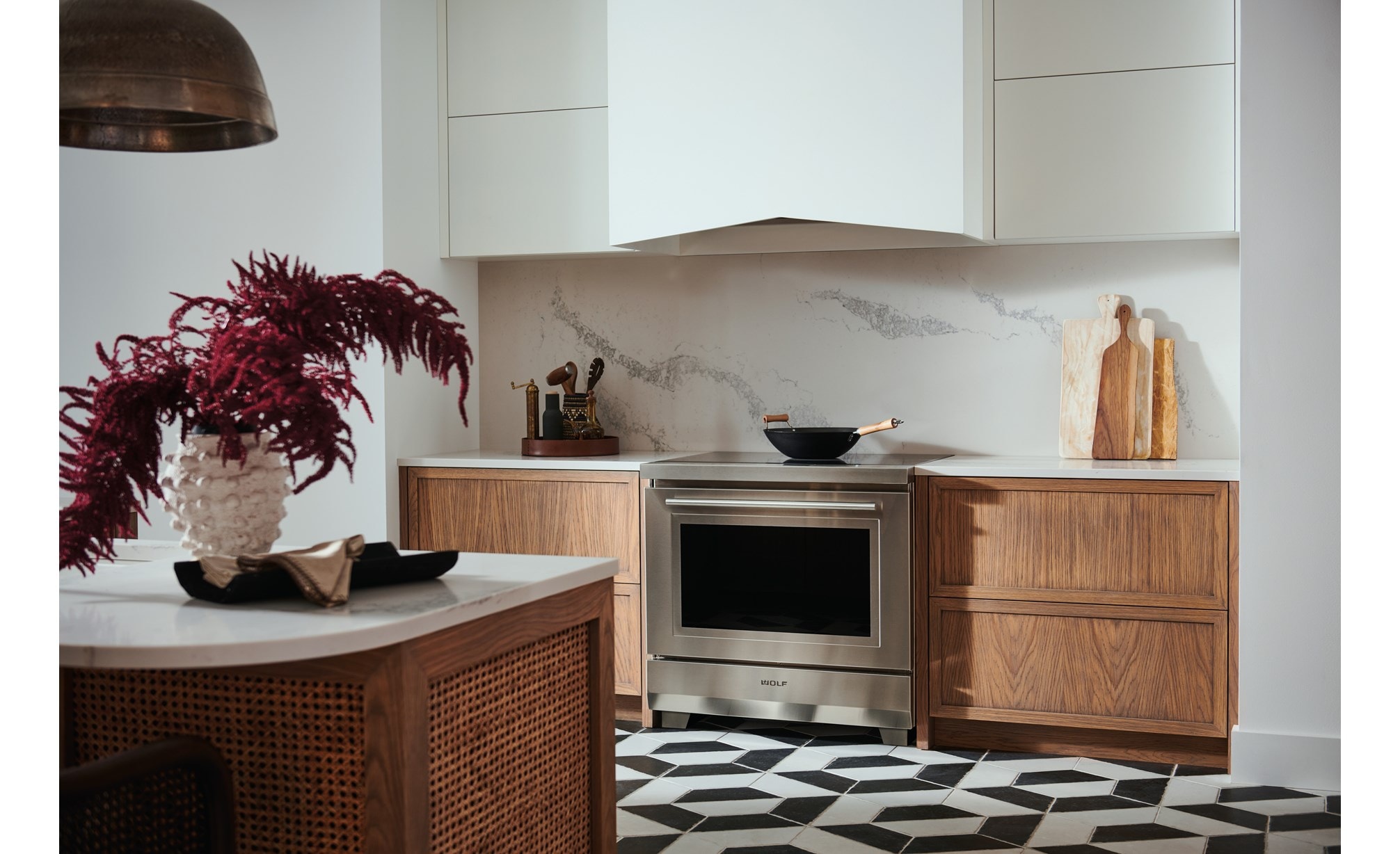 Wolf 36" Transitional Induction Range (IR36550/S/T) shown with Wolf 40" Pro Hood Liner (PL402212)