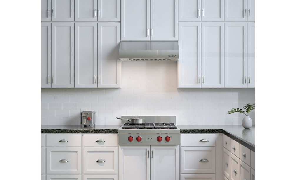 The Wolf 30" Sealed 4 Burner Rangetop (SRT304) paired with Wolf 30" Low Profile Wall Hood (PW302210)