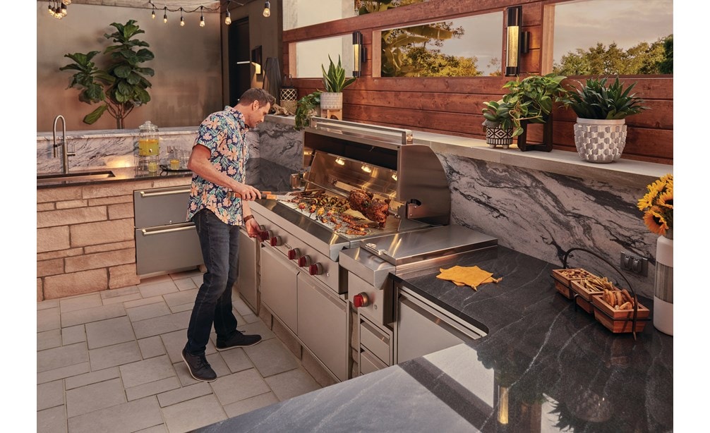 The Wolf 54" Outdoor Gas Grill (OG54) paired with Wolf 13" Classic Burner Module (BM13) for total outdoor kitchen versatility.