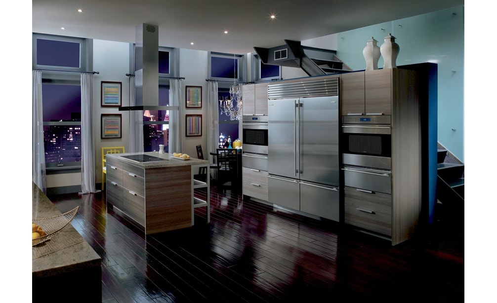 Pair of Wolf 30" E Series Transitional Classic Single Ovens (SO30TE/S/TH) on each side of Sub-Zero 30" Classic Over Under Refrigerator (BI-30U/S)