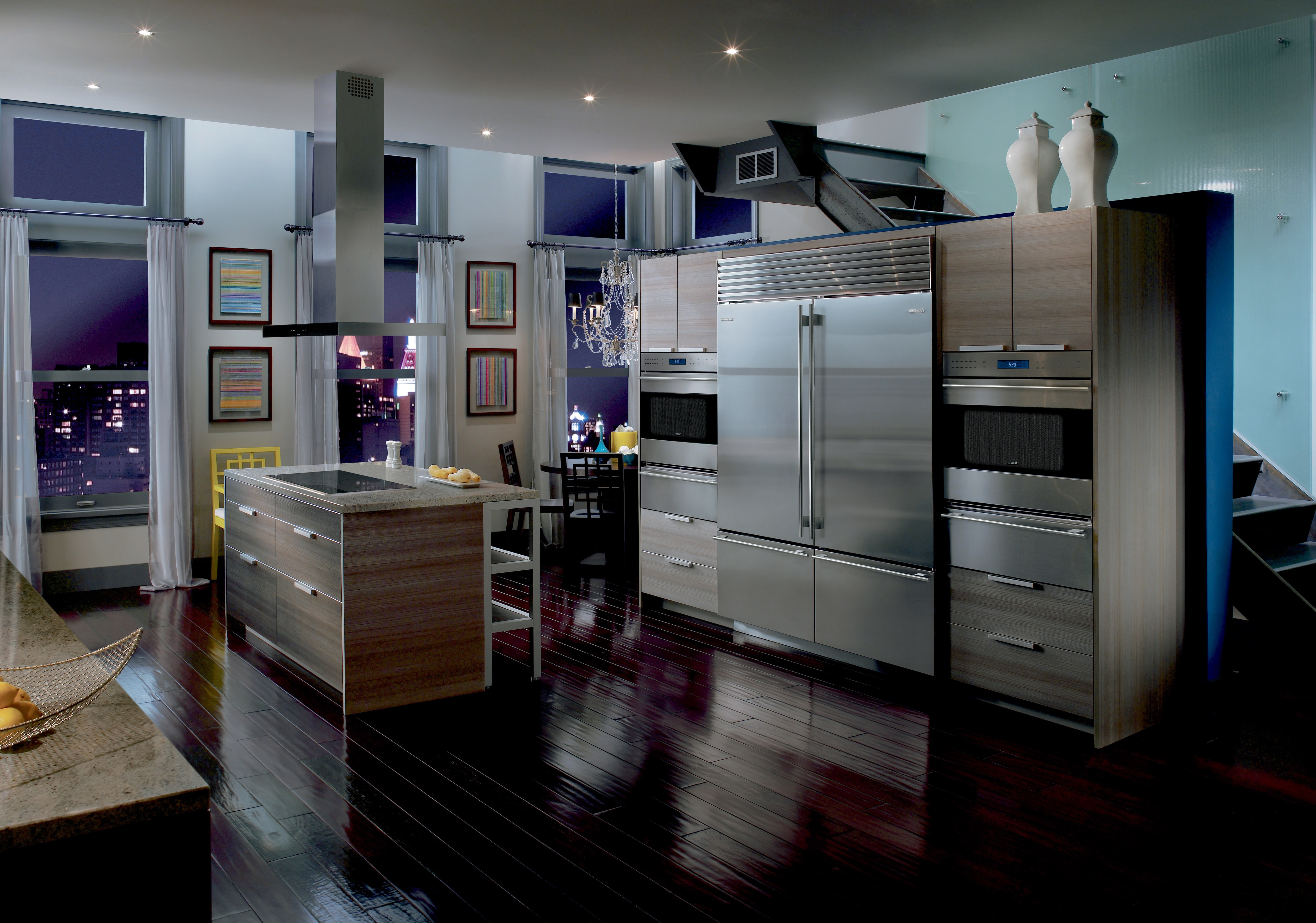 Pair of Wolf 30" E Series Transitional Classic Single Ovens (SO30TE/S/TH) on each side of Sub-Zero 30" Classic Over Under Refrigerator (BI-30U/S)