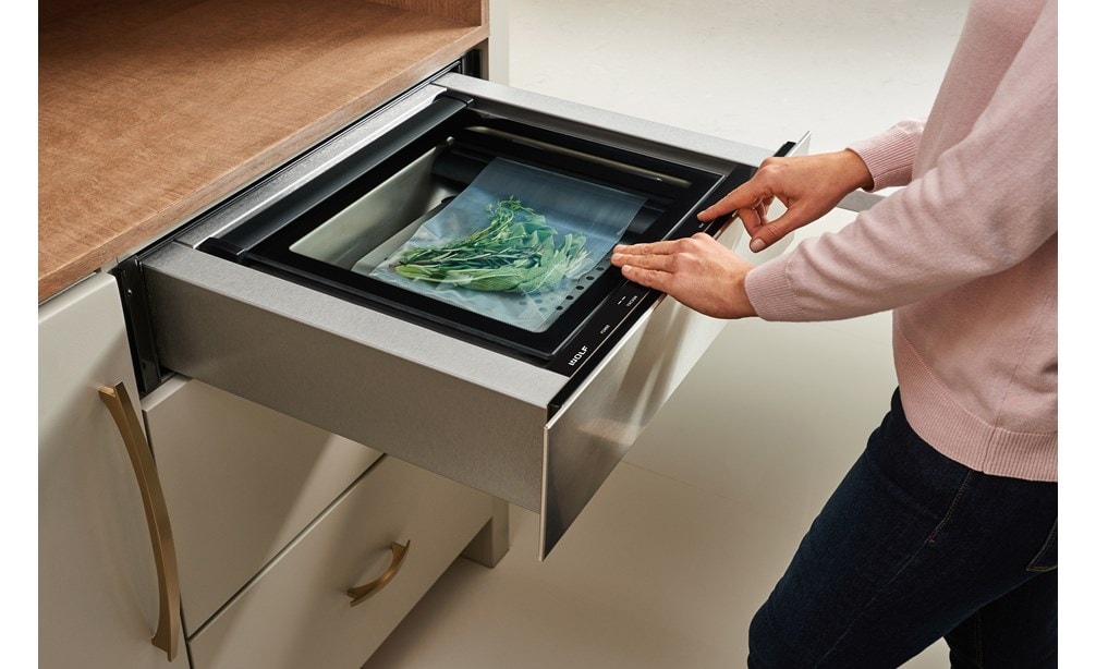 Wolf vacuum seal drawers remove air and seal foods or liquids for easy storage, marinating, and cooking.