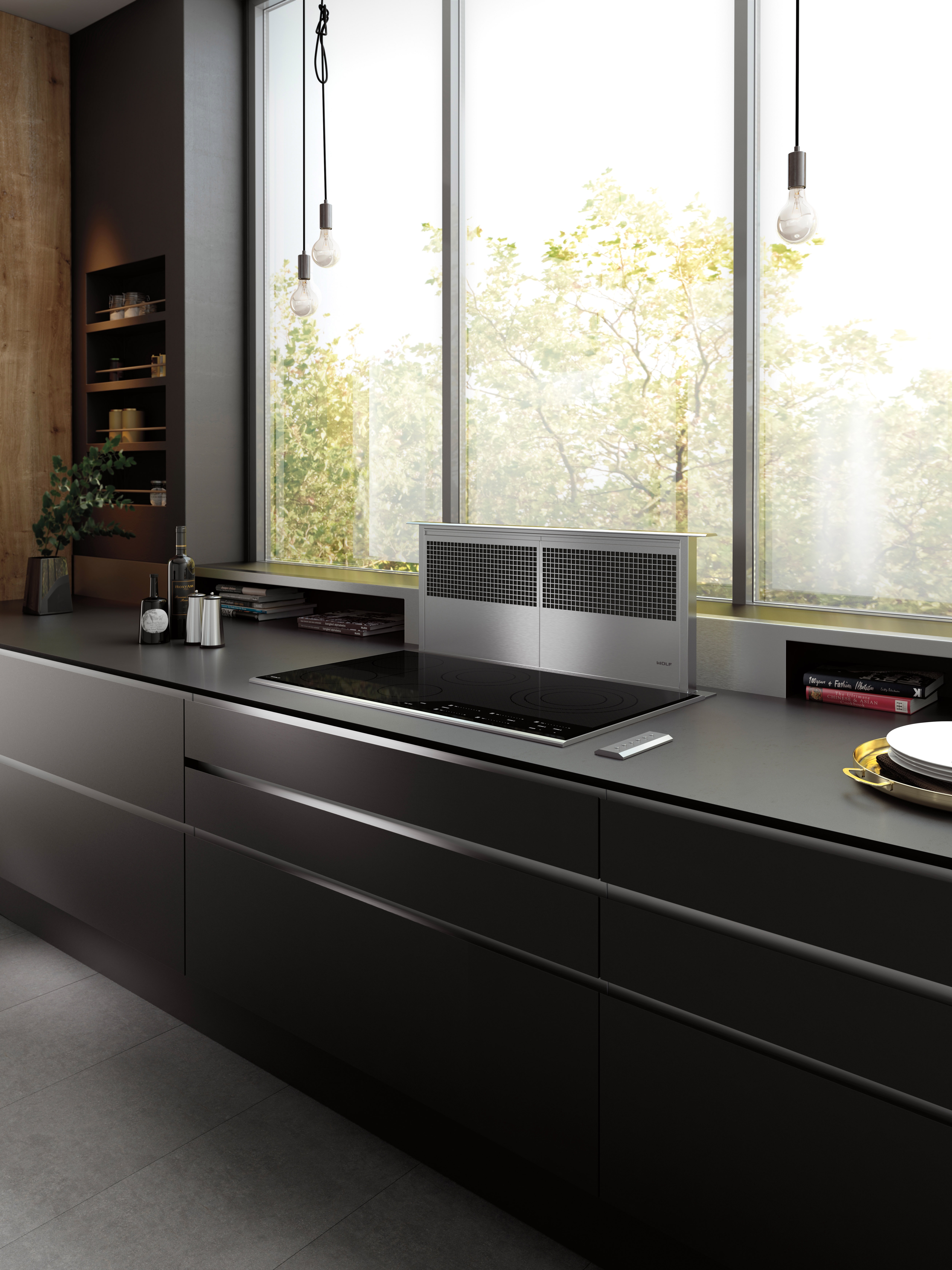 Wolf 36" Downdraft Ventilation (DD36) shown with 36" Contemporary Electric Cooktop (CE365C/B) in a luxurious modern kitchen