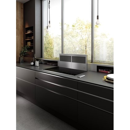 Wolf 36" Downdraft Ventilation (DD36) shown with 36" Contemporary Electric Cooktop (CE365C/B) in a luxurious modern kitchen