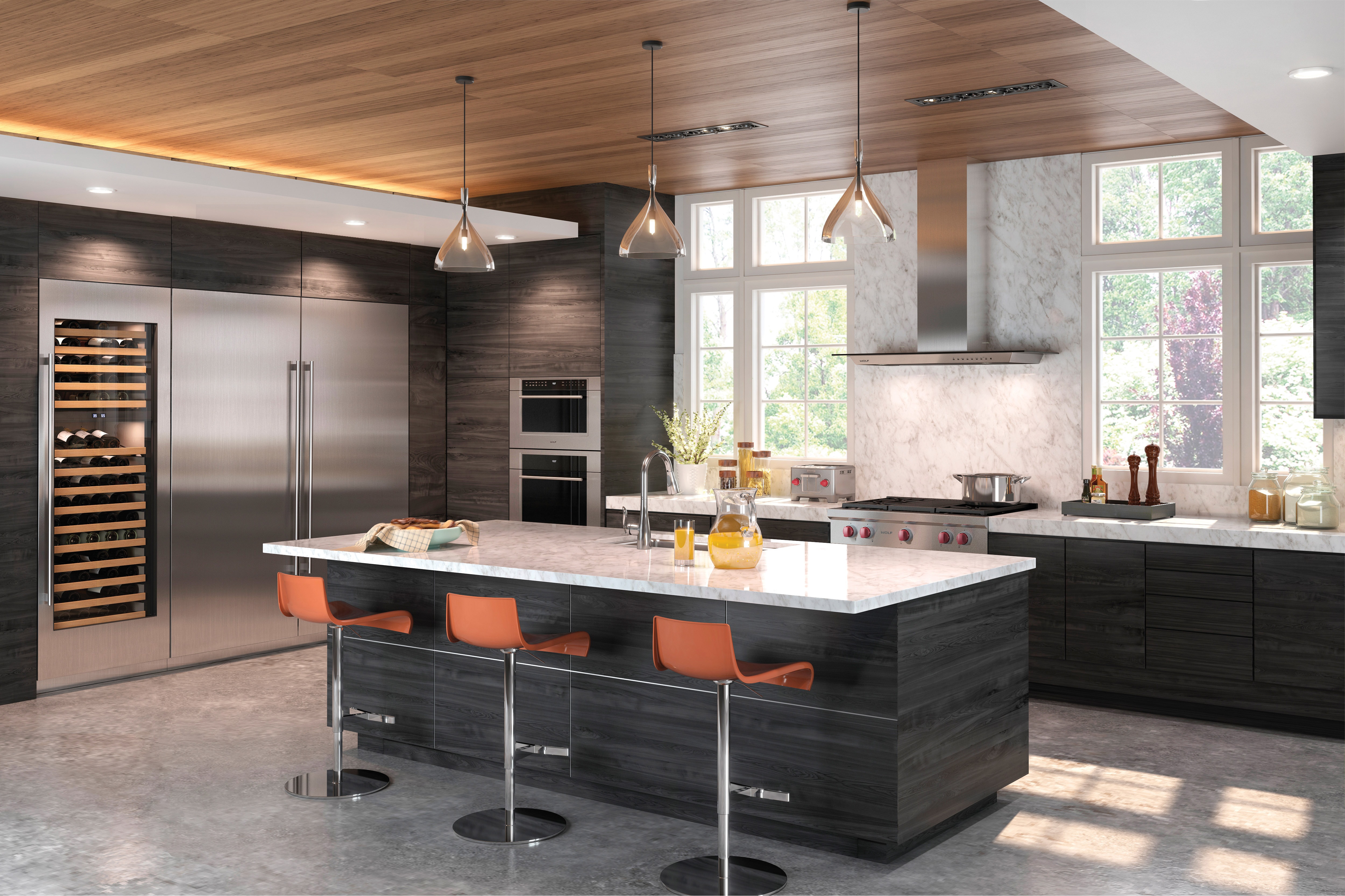 The Wolf 36" Cooktop Wall Hood - Glass (VW36G) shown centered on large textured backsplash between large windows in open kitchen design