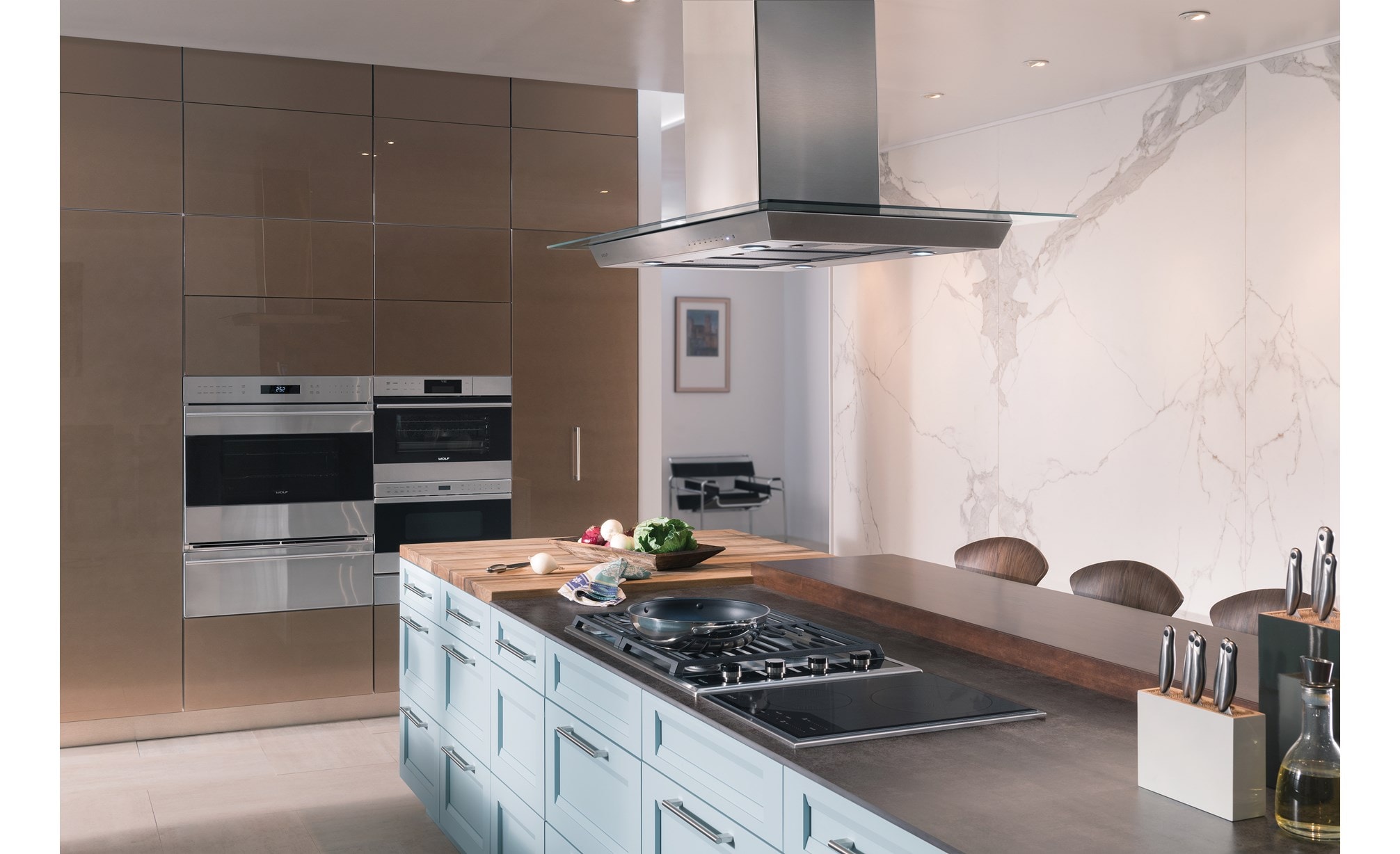 Wolf 45" Cooktop Island Hood (VI45G) paired with Wolf 30" Transitional Gas Cooktop 4 Burners (CG304T/S) in modern kitchen