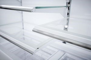 Close up view of Sub-Zero Classic Series Full Size Refrigerator's LED lit  custom shelves