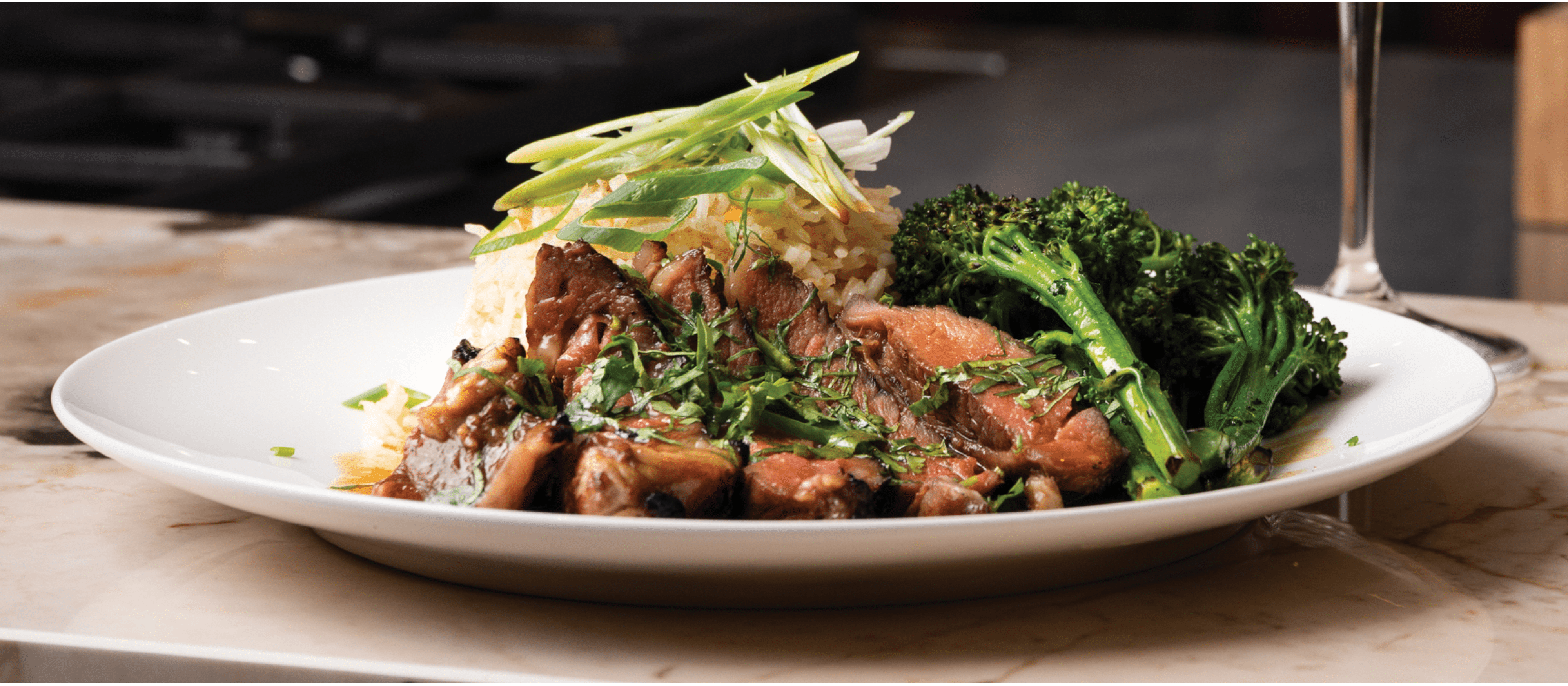 Glazed Teriyaki infused Rib of Beef with Steamed Coconut Fried Rice and Charred Sesame Broccoli