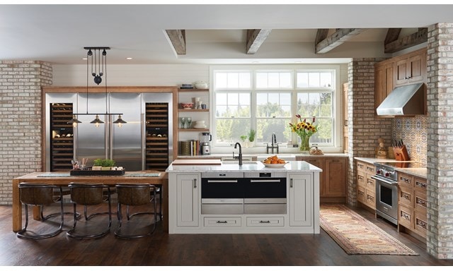 Nordic farmhouse kitchen design featuring Sub-Zero Designer Series Refrigerator and Wine Storage unit with Wolf Induction Range, Microwave Oven and Ventilation Hood