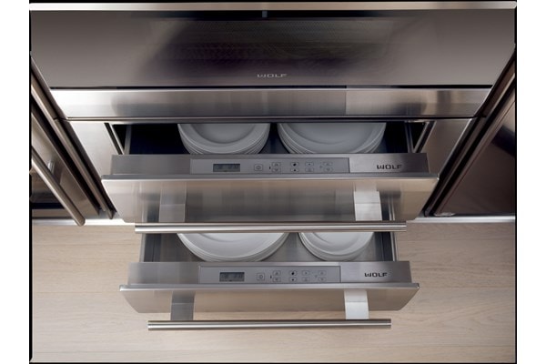 Two Wolf 30" Warming Drawers stacked and holding dishes 