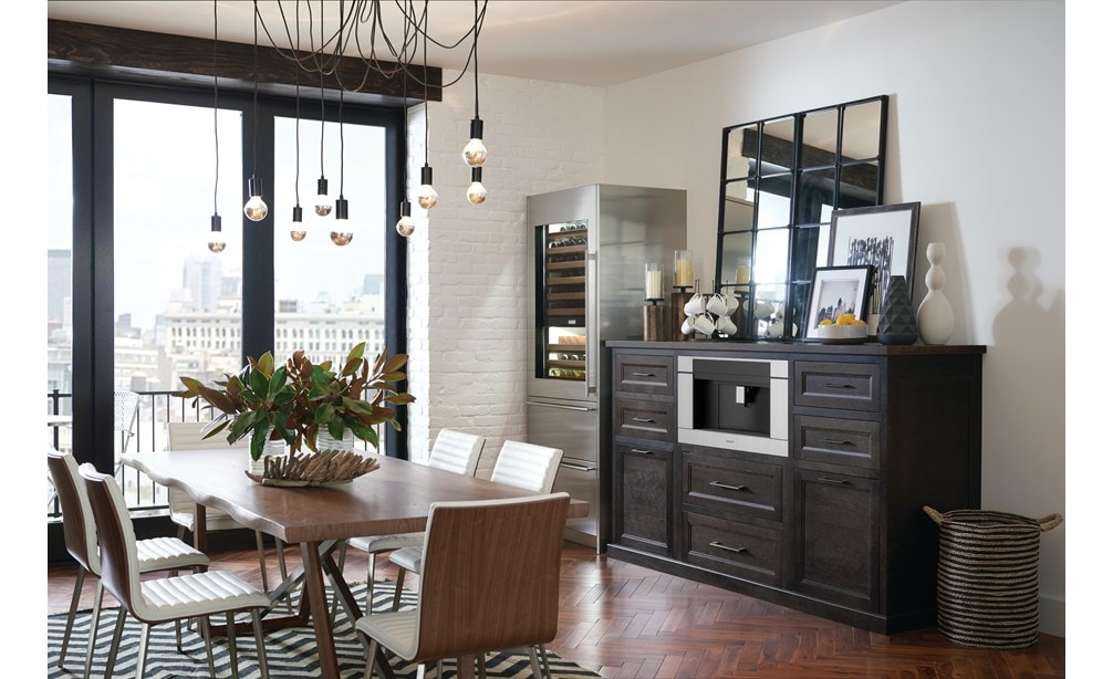 The Wolf 24" Coffee System Black Glass (EC24/B) shown set in a rustic pantry-style coffee station conveniently located in dining room