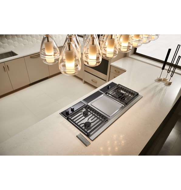 Wolf 15" Transitional Framed Gas Cooktop (CG152TF/S) shown in minimalist modern kitchen in sleek white glossy countertop island