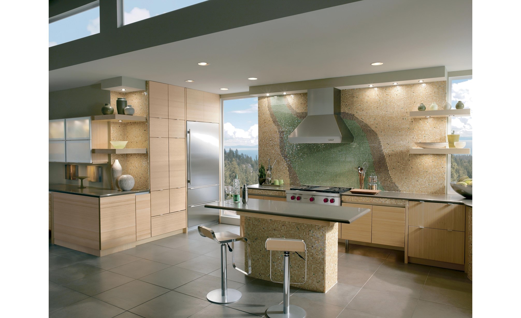 The Wolf 36" Sealed 4 Burner Rangetop and Infrared Griddle (SRT364G) shown in stylish large tile floor open concept kitchen.