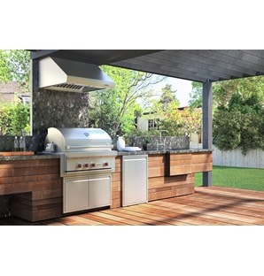 The Wolf 36" Outdoor Gas Grill (OG36) shown with Wolf Professional Grade Outdoor Ventilation Hood in this large outdoor kitchen. 