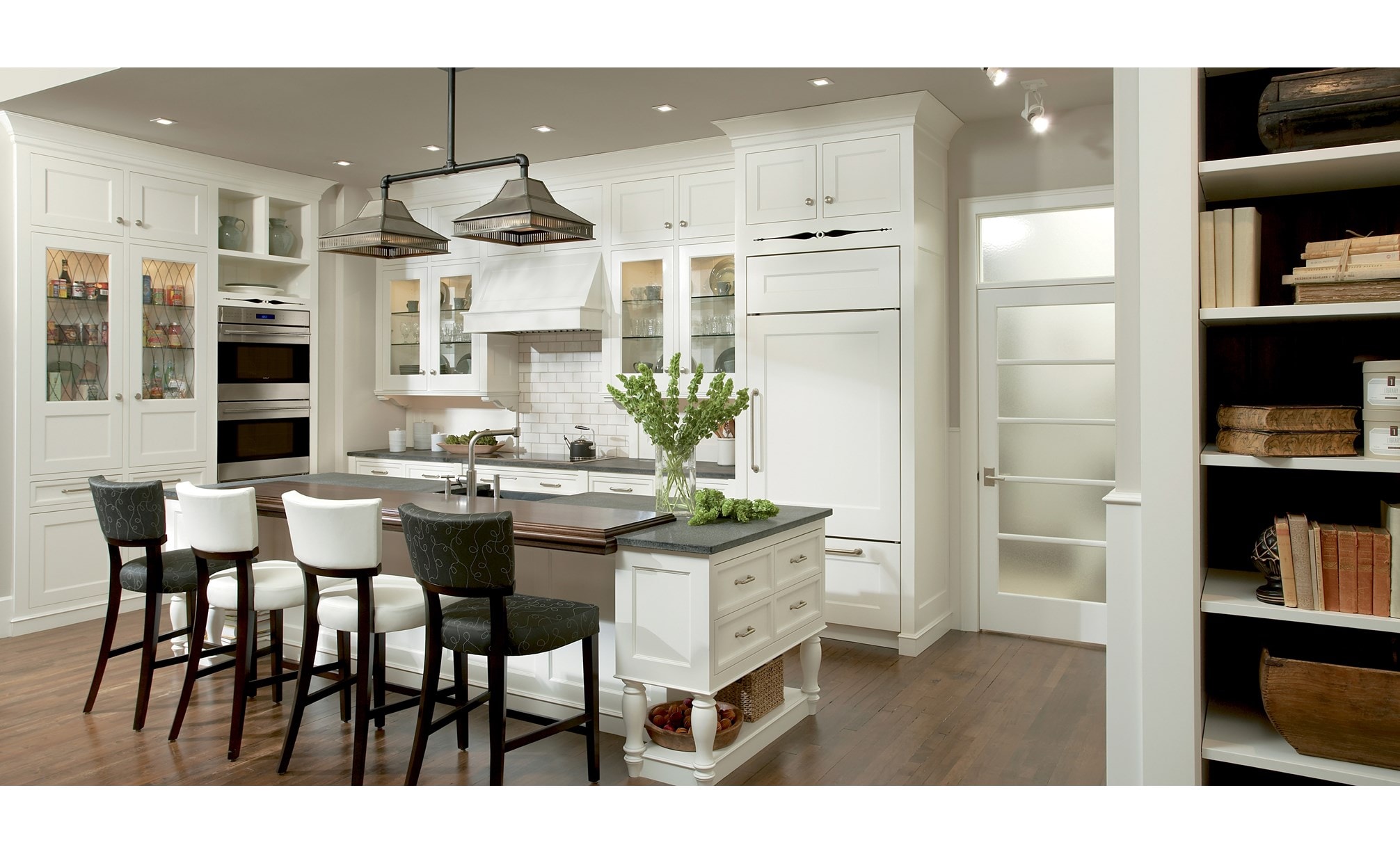 The Wolf 30" E Series Transitional Built-In Double Oven (DO30TE/S/TH) shown complementing a crisp integrated classic kitchen design.