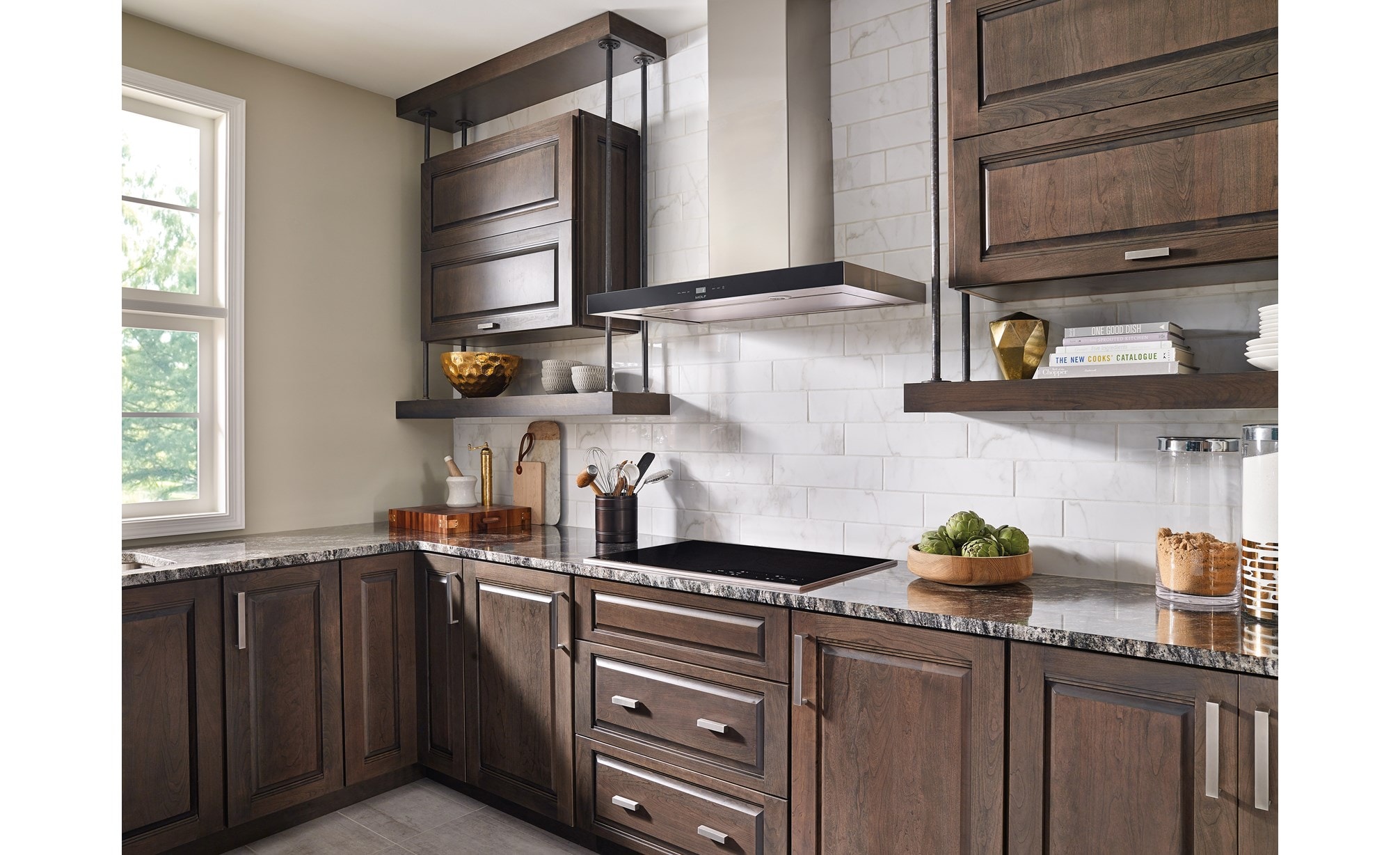 The Wolf 36" Cooktop Wall Hood - Black (VW36B) shown in a charming contemporary space featuring rustic accents