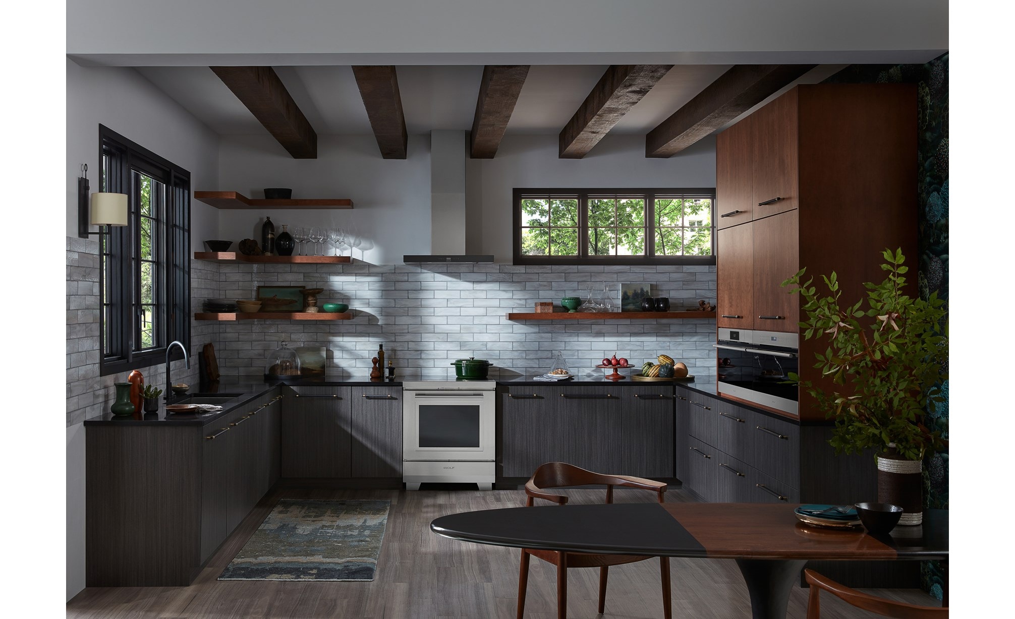 Wolf 30" Induction Range shown in luxurious New York townhome featuring open shelves, wood ceiling beams and cast iron accents.