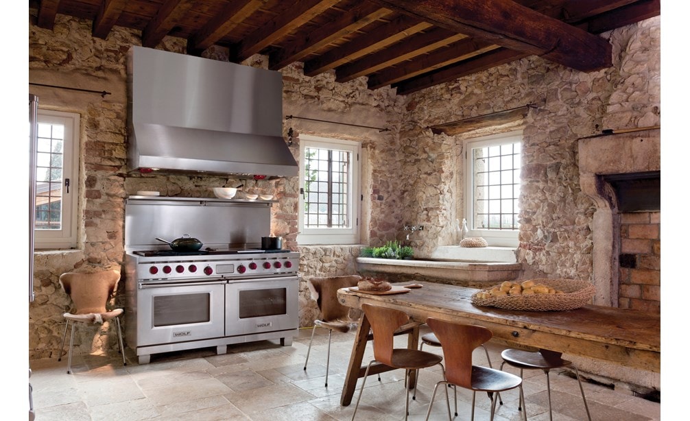 The Wolf 60" Dual Fuel Range 6 Burner Infrared Charbroiler Griddle (DF606CG) shown with Wolf 60" Pro Wall Hood - 27" Depth (PW602718)