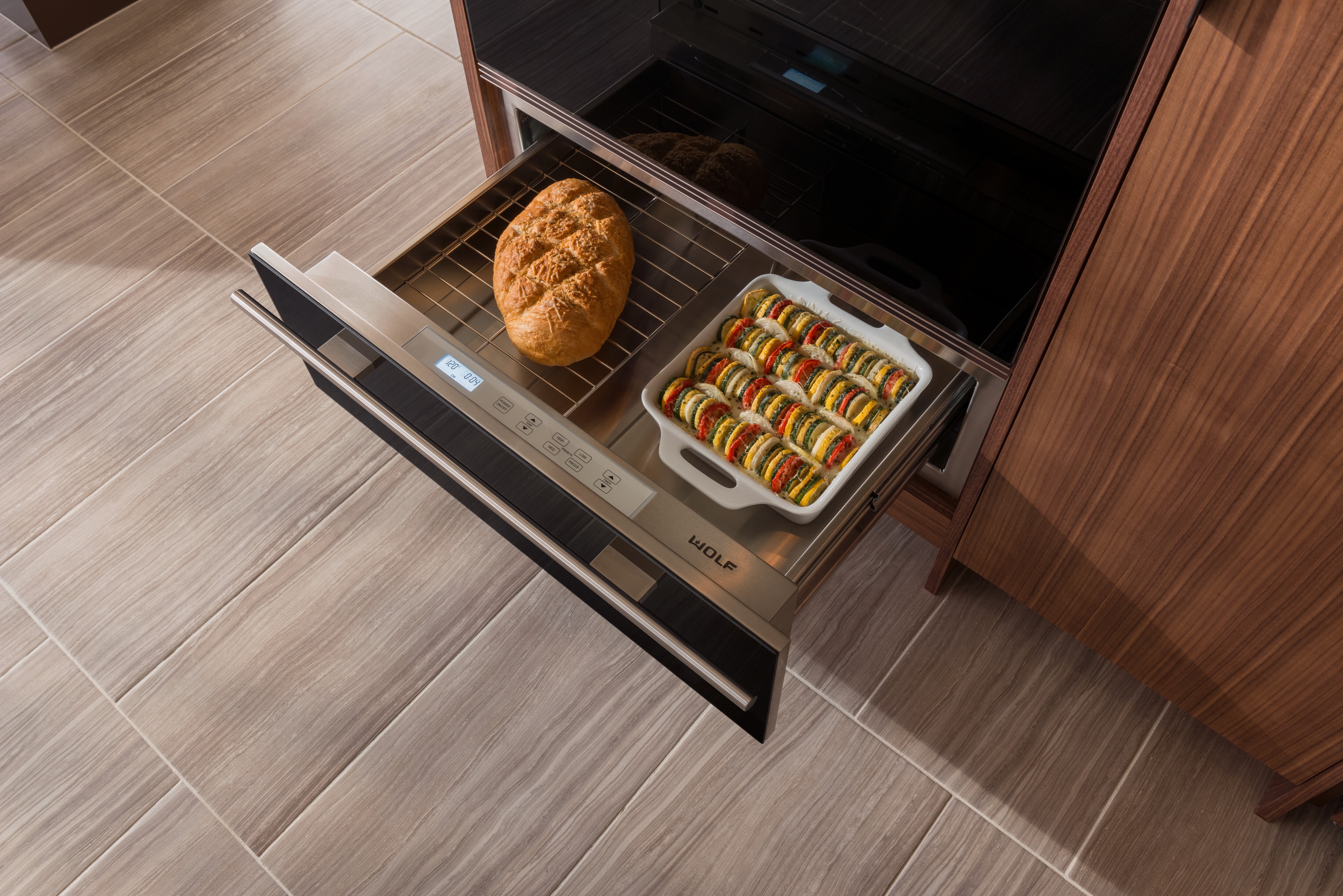 Fresh bread and roasted vegetables in the Wolf Indoor/Outdoor Warming Drawer