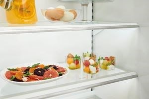 Close up view of Sub-Zero Classic Series Full Size Refrigerator's LED lit custom shelves